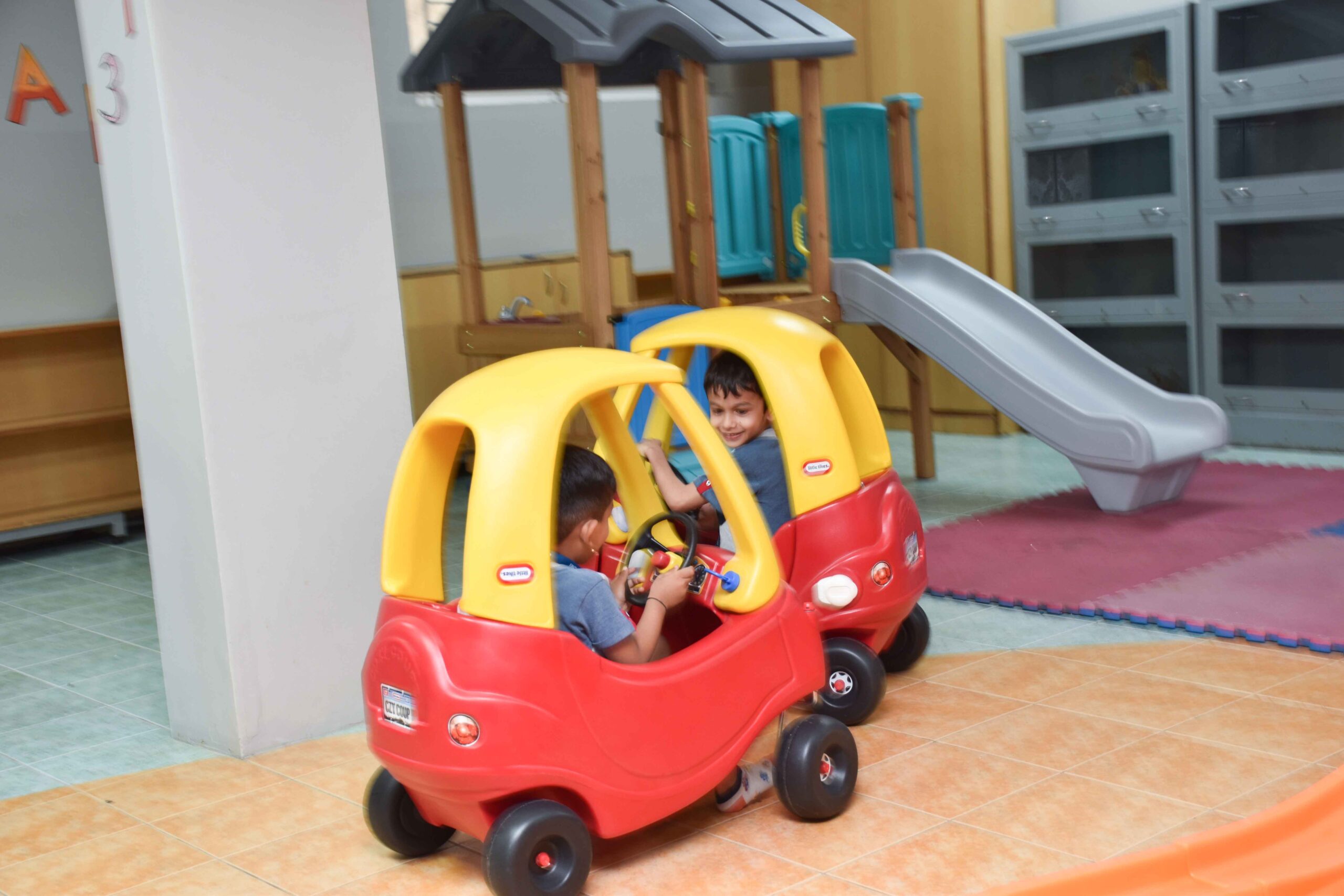 kids enjoying toy car Happy Cherubs kids playing with toy car
