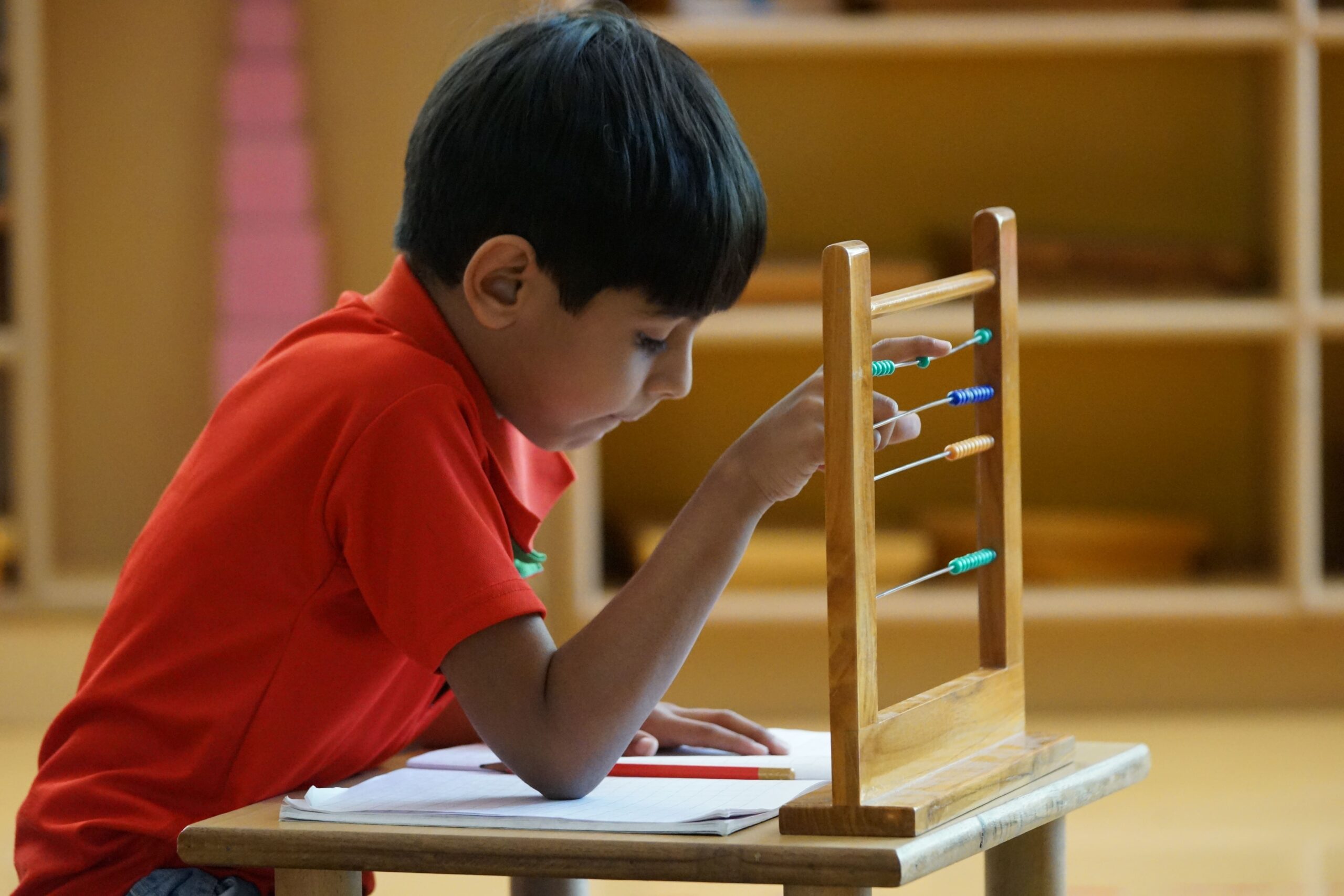 kids learning with abacus at cherubs Montessori