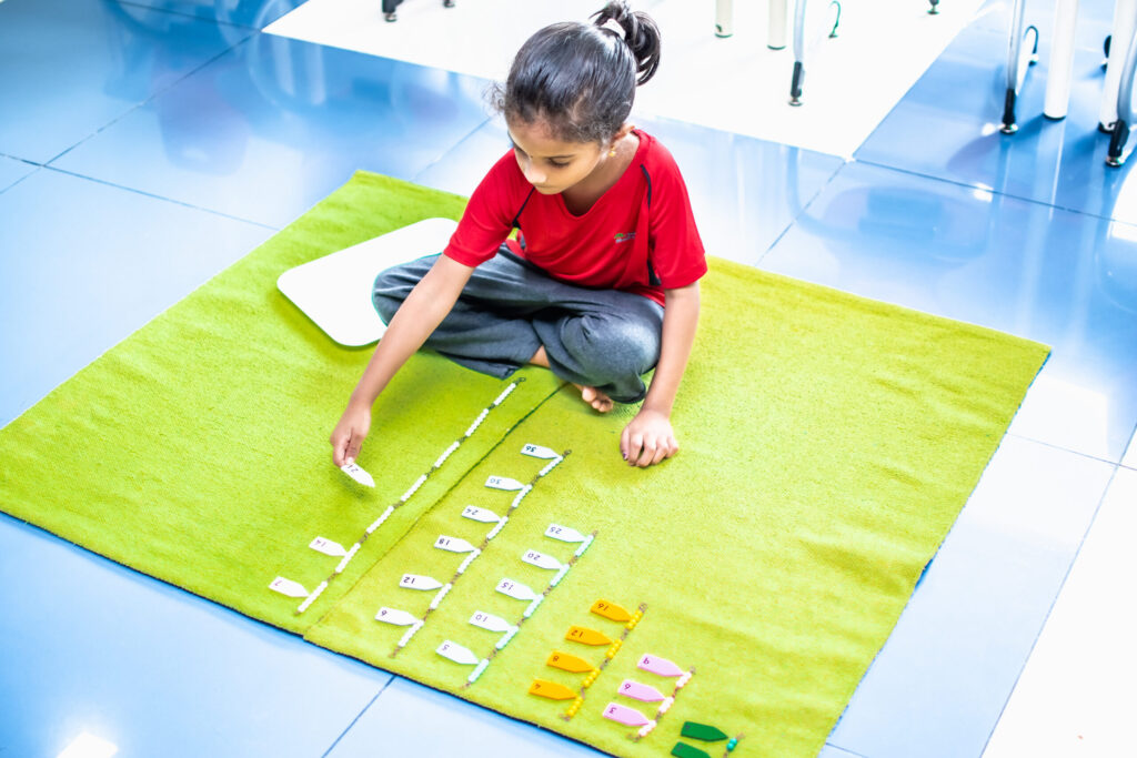 Certified Montessori Teacher Guiding Students in HSR Layout