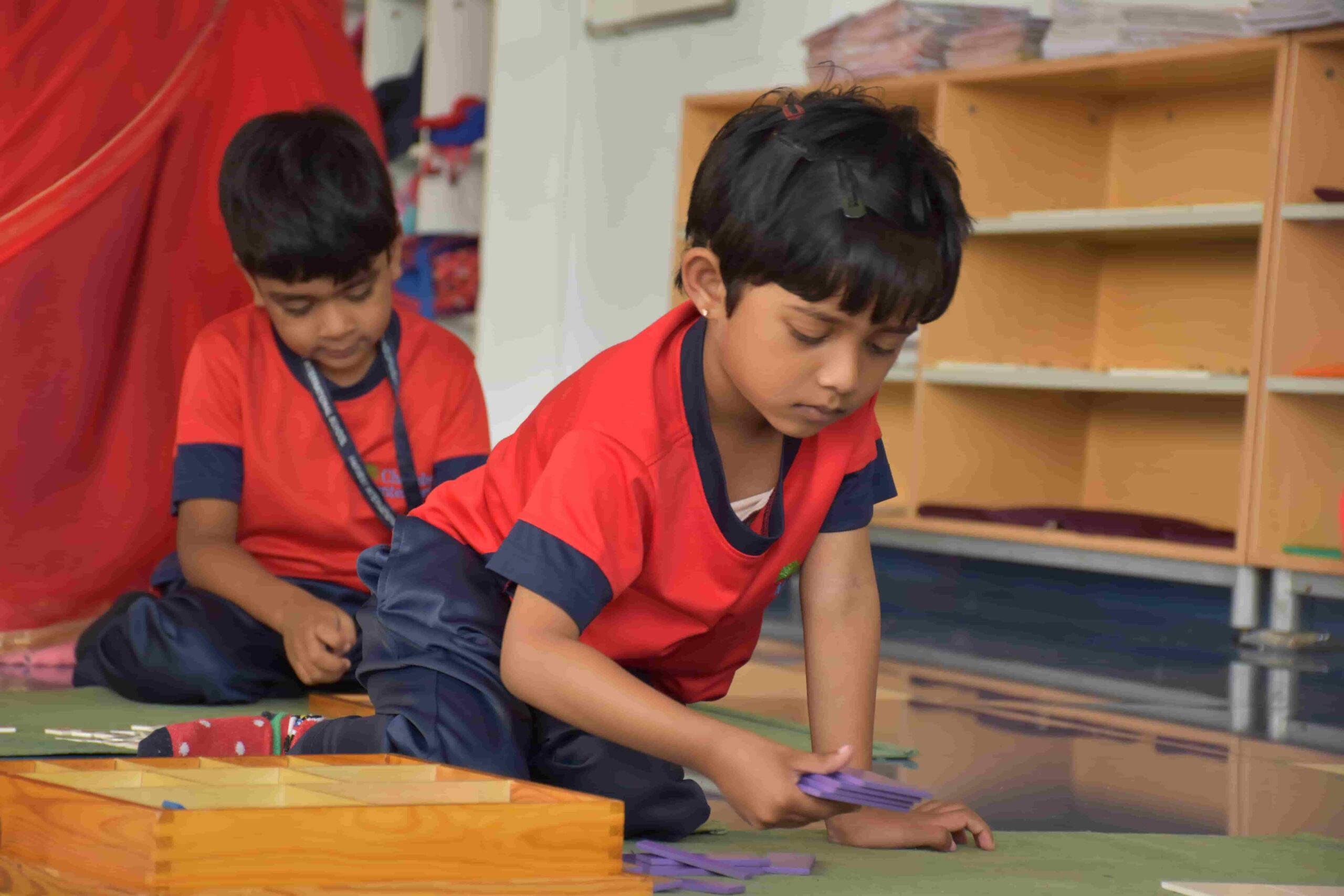Child learning shapes using Montessori materials